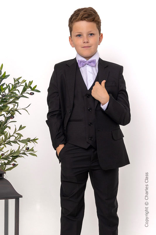 black suit with purple bow tie